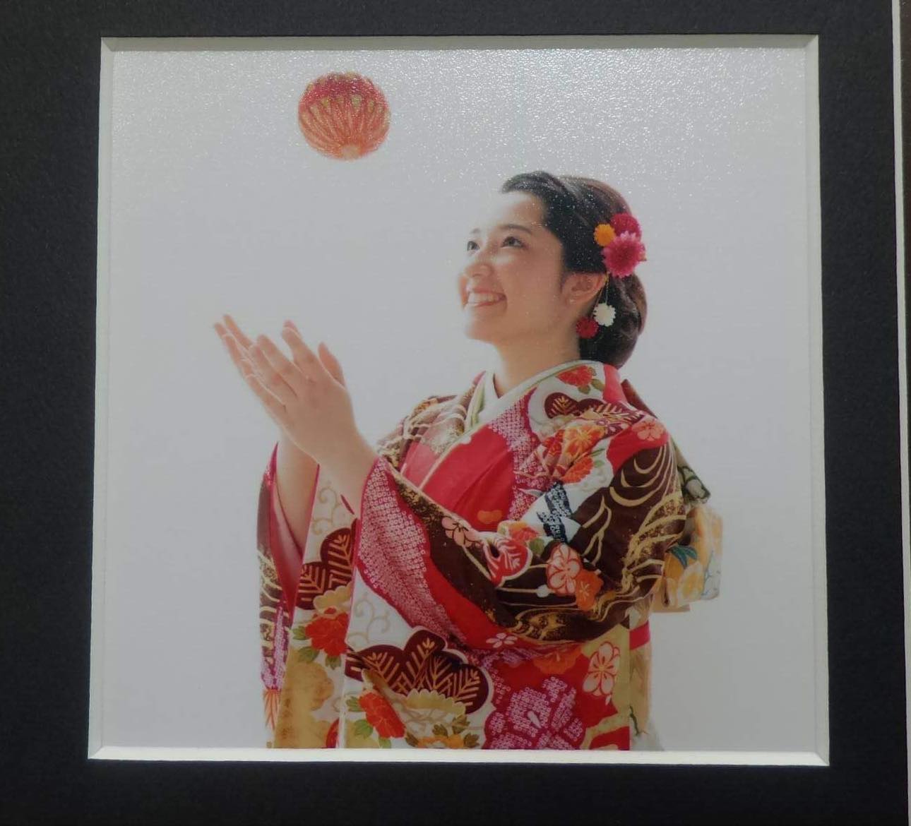 Girl in Kimono throwing ball 